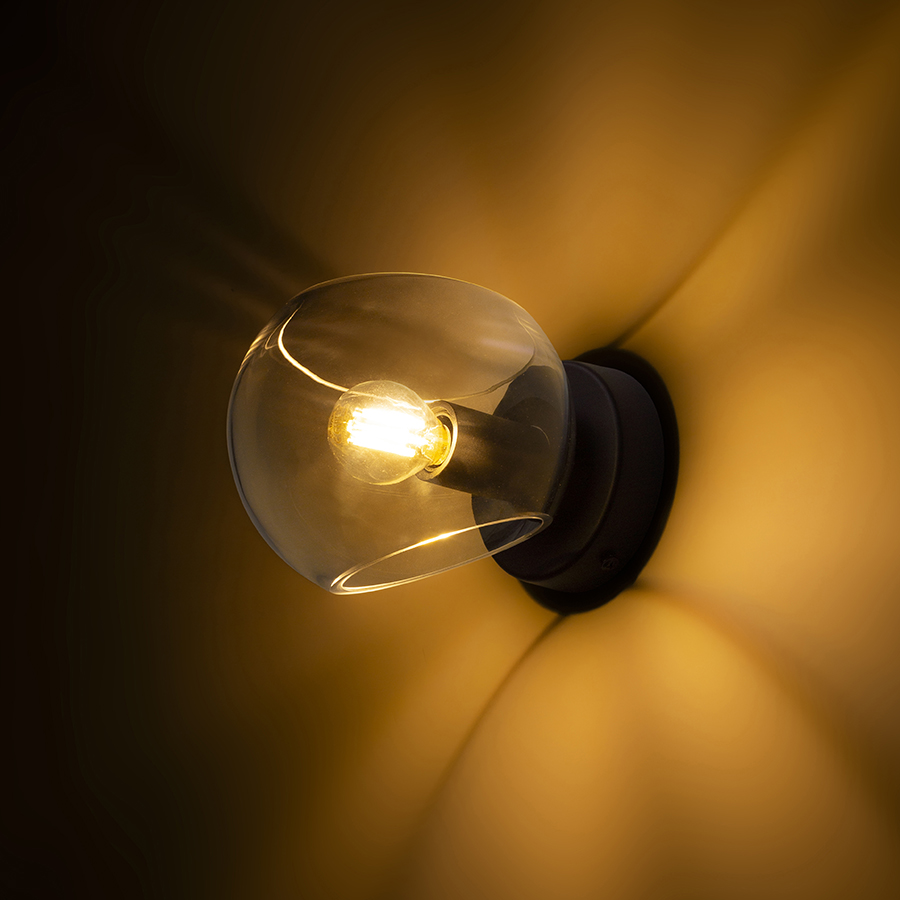 O lampă de sticlă montată pe suprafată, cu o baza lacuita neagră, SOLARIS montat pe suprafață transparentă/negru 230V LED E14 7W